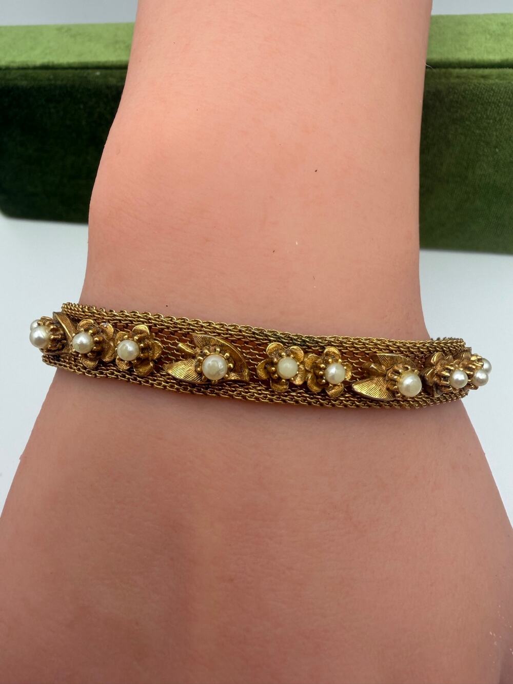 vintage gold-tone mesh chain bracelet featuring an row of floral and leaf